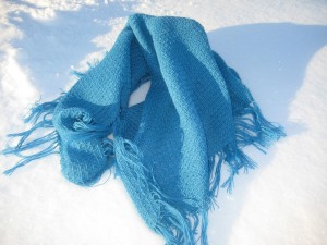 A blue shawl on the snow.